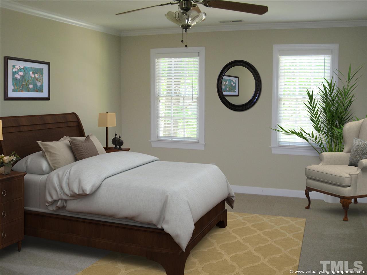 9904 Bright Hedge Court Raleigh, NC 27613 - Photo 12 of 20 a bedroom with a bed and a chair with the potted plant