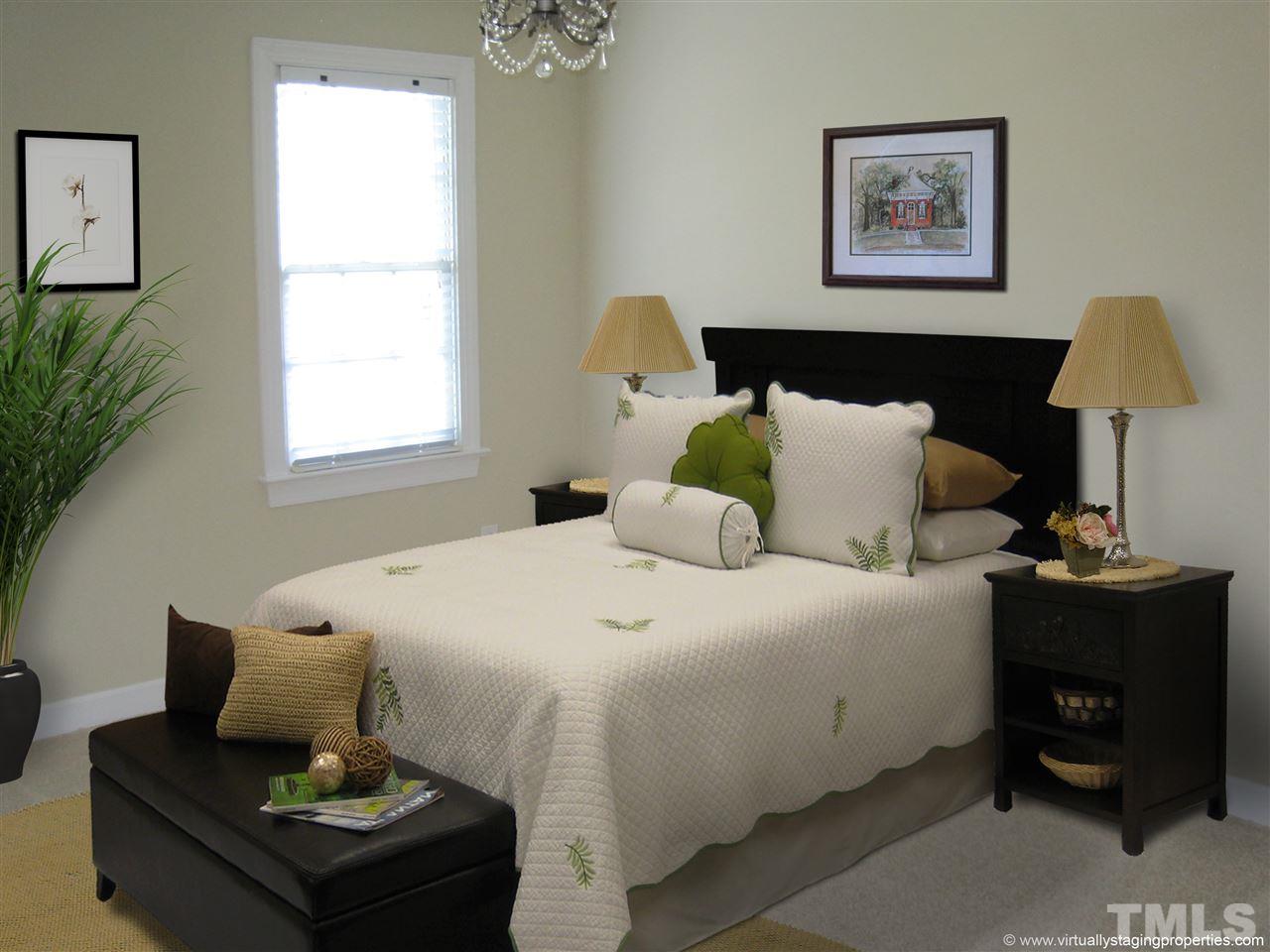 9904 Bright Hedge Court Raleigh, NC 27613 - Photo 15 of 20 a bedroom with a bed and a window