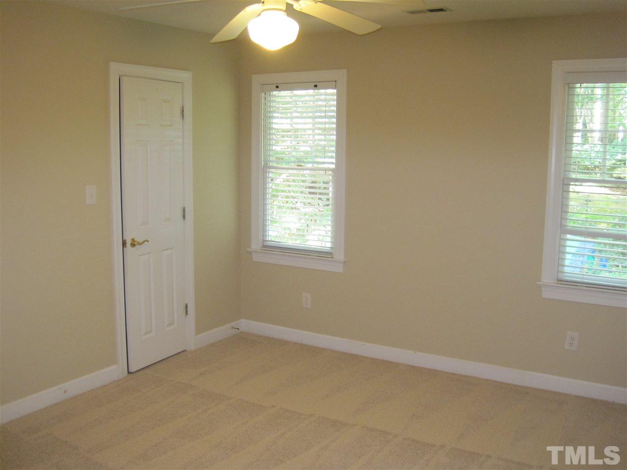 9904 Bright Hedge Court Raleigh, NC 27613 - Photo 16 of 20 an empty room with windows