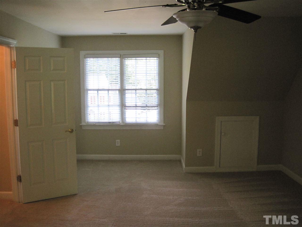 9904 Bright Hedge Court Raleigh, NC 27613 - Photo 18 of 20 an empty room with a window