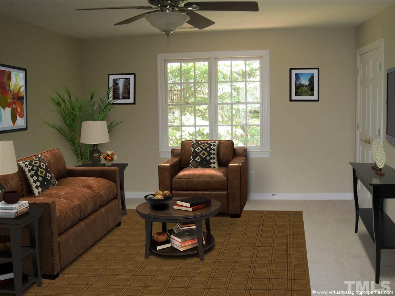 9904 Bright Hedge Court Raleigh, NC 27613 - Photo 19 of 20 a living room with furniture and a window