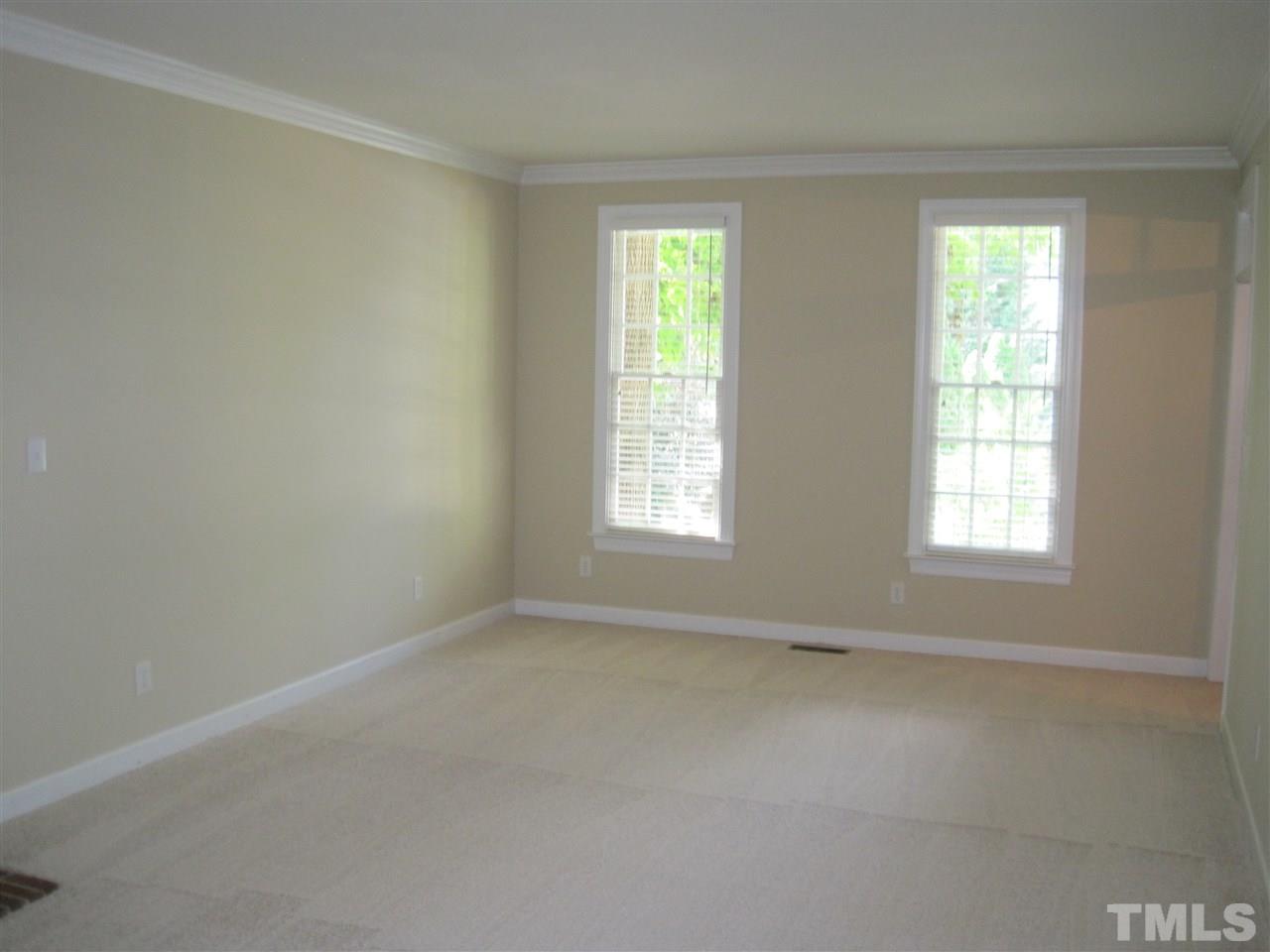9904 Bright Hedge Court Raleigh, NC 27613 - Photo 5 of 20 an empty room with windows