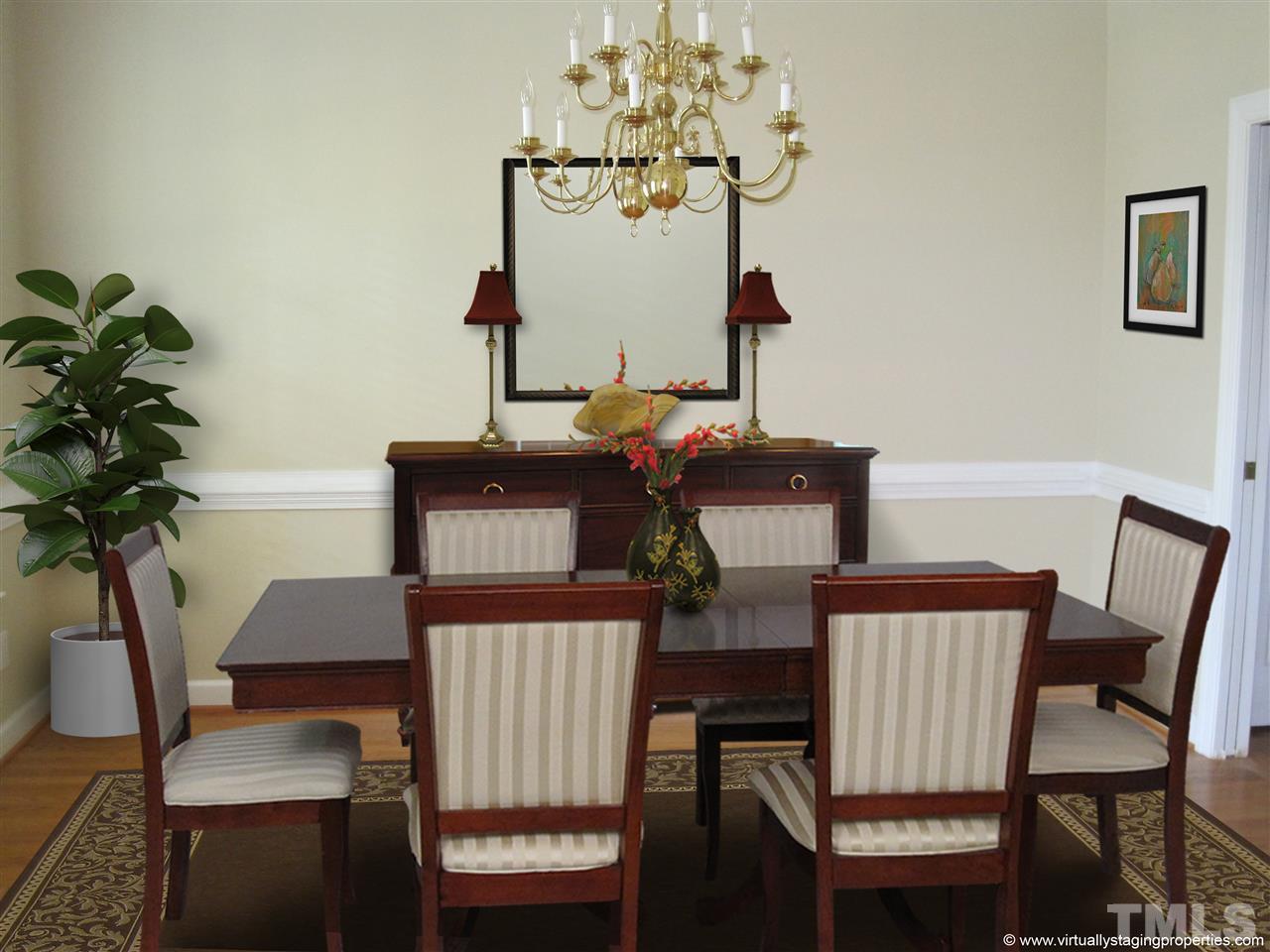 9904 Bright Hedge Court Raleigh, NC 27613 - Photo 6 of 20 a view of a dining room with furniture and wooden floor