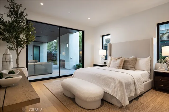 a bedroom with a large bed and a couch