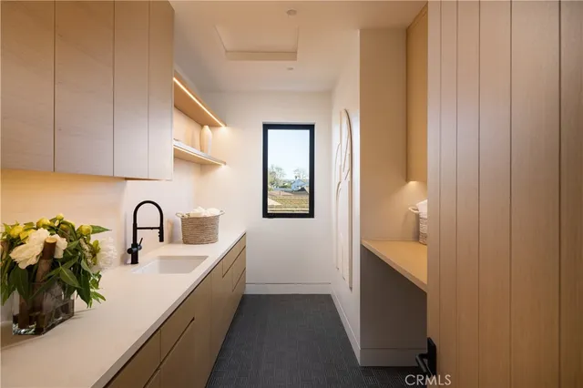 a kitchen with a sink and a window