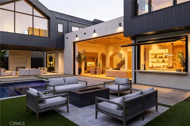 a outdoor living space with furniture and a flat screen tv