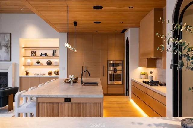 a kitchen with a sink and refrigerator