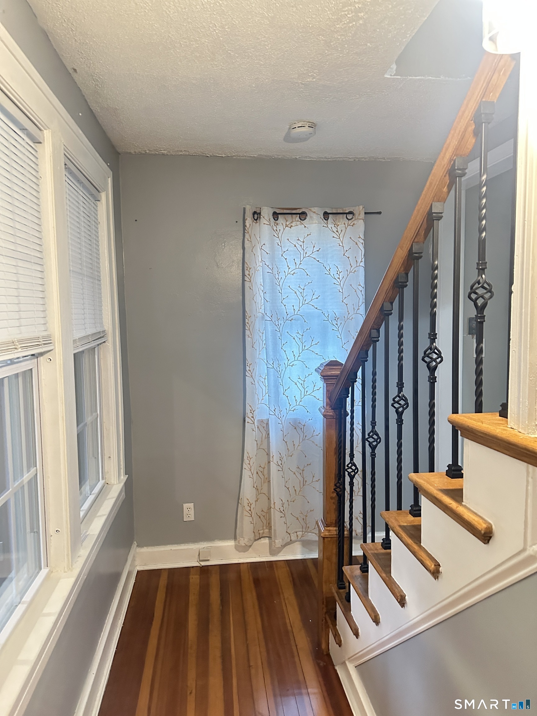 83 Faneuil Street Windsor, CT 06095 - Photo 4 of 14 a view of front door with wooden floor and door