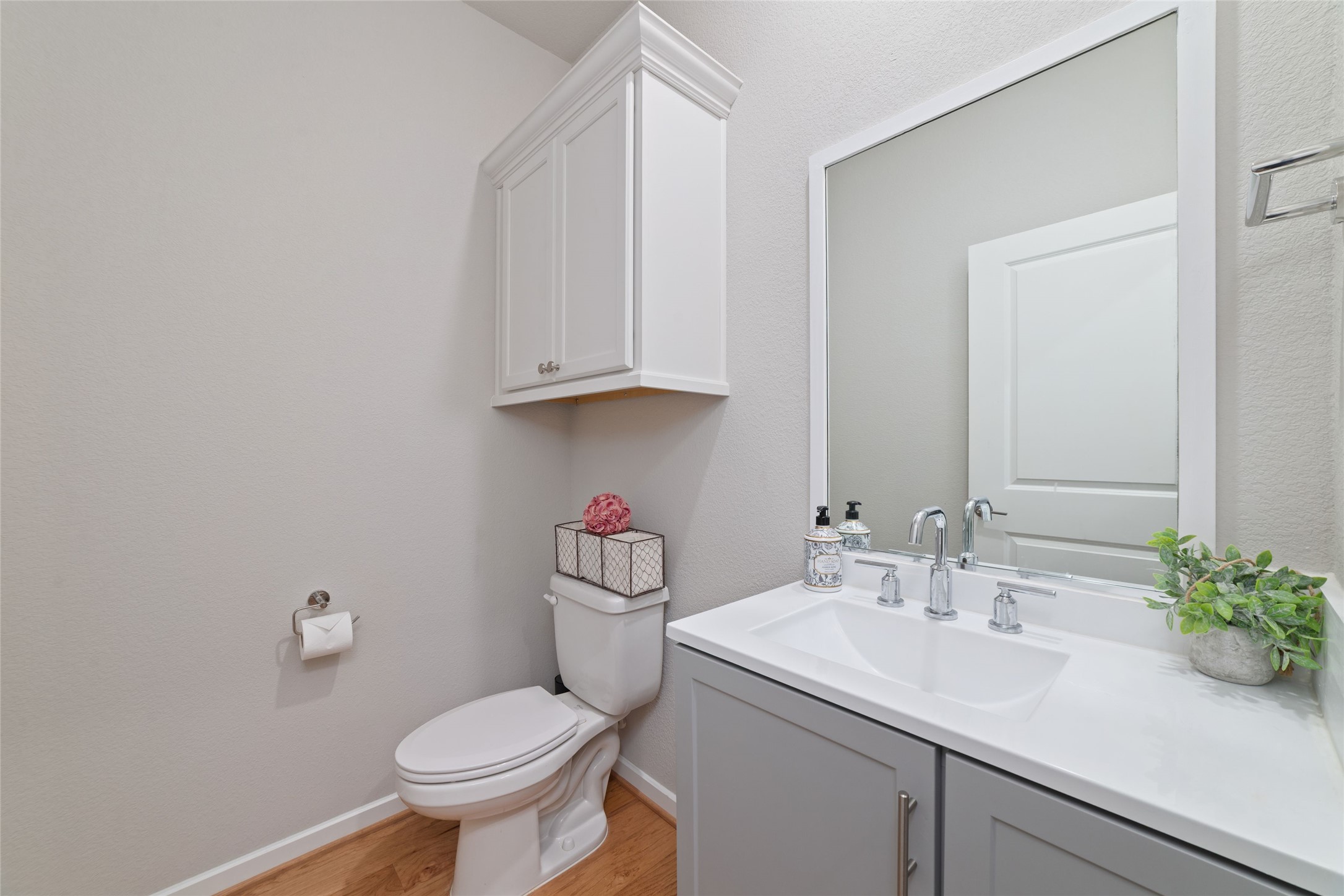 22122 Sam Raburn Drive Tomball, TX 77375 - Photo 14 of 47 a bathroom with a sink toilet and a mirror