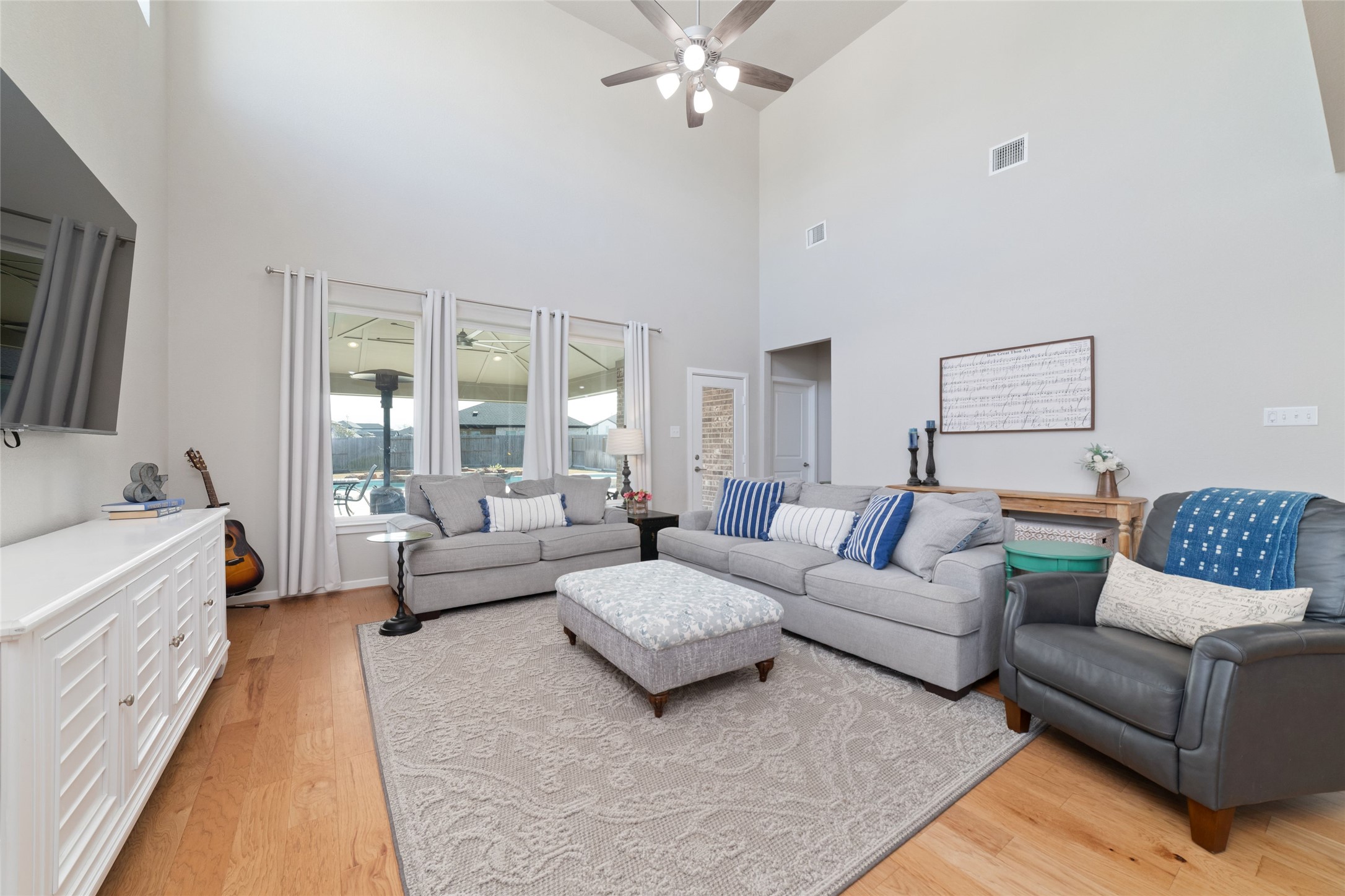 22122 Sam Raburn Drive Tomball, TX 77375 - Photo 19 of 47 View from the dining table looking into the large family room, and beyond to the sparkling pool in the backyard.