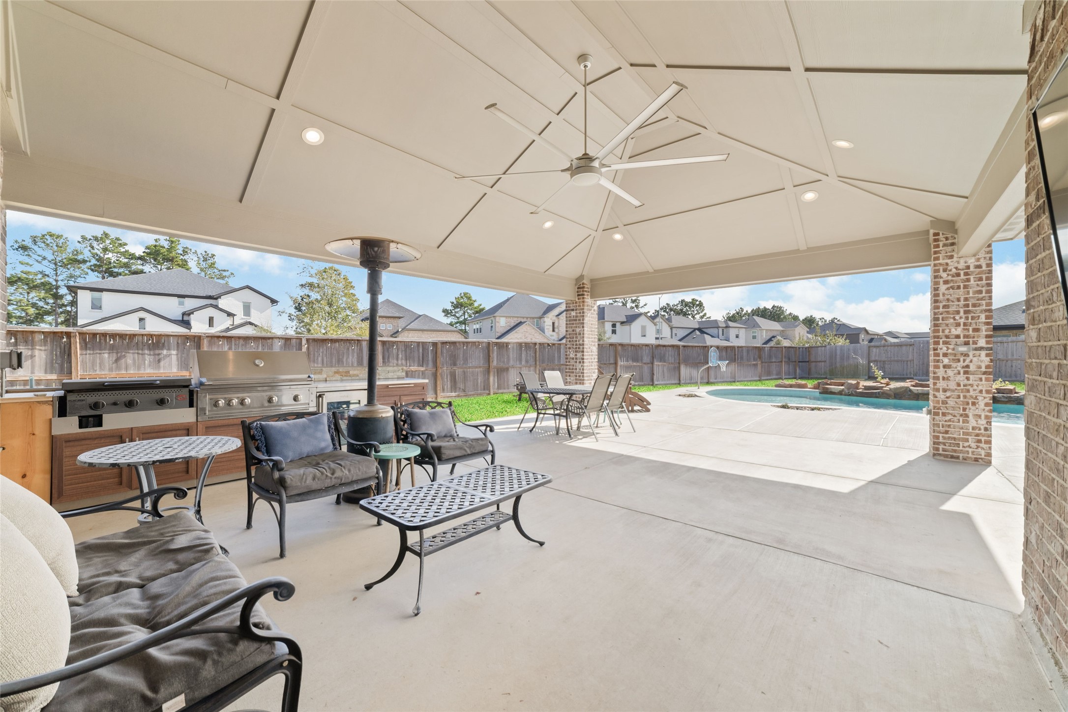 22122 Sam Raburn Drive Tomball, TX 77375 - Photo 20 of 47 a living room with furniture and a floor to ceiling window