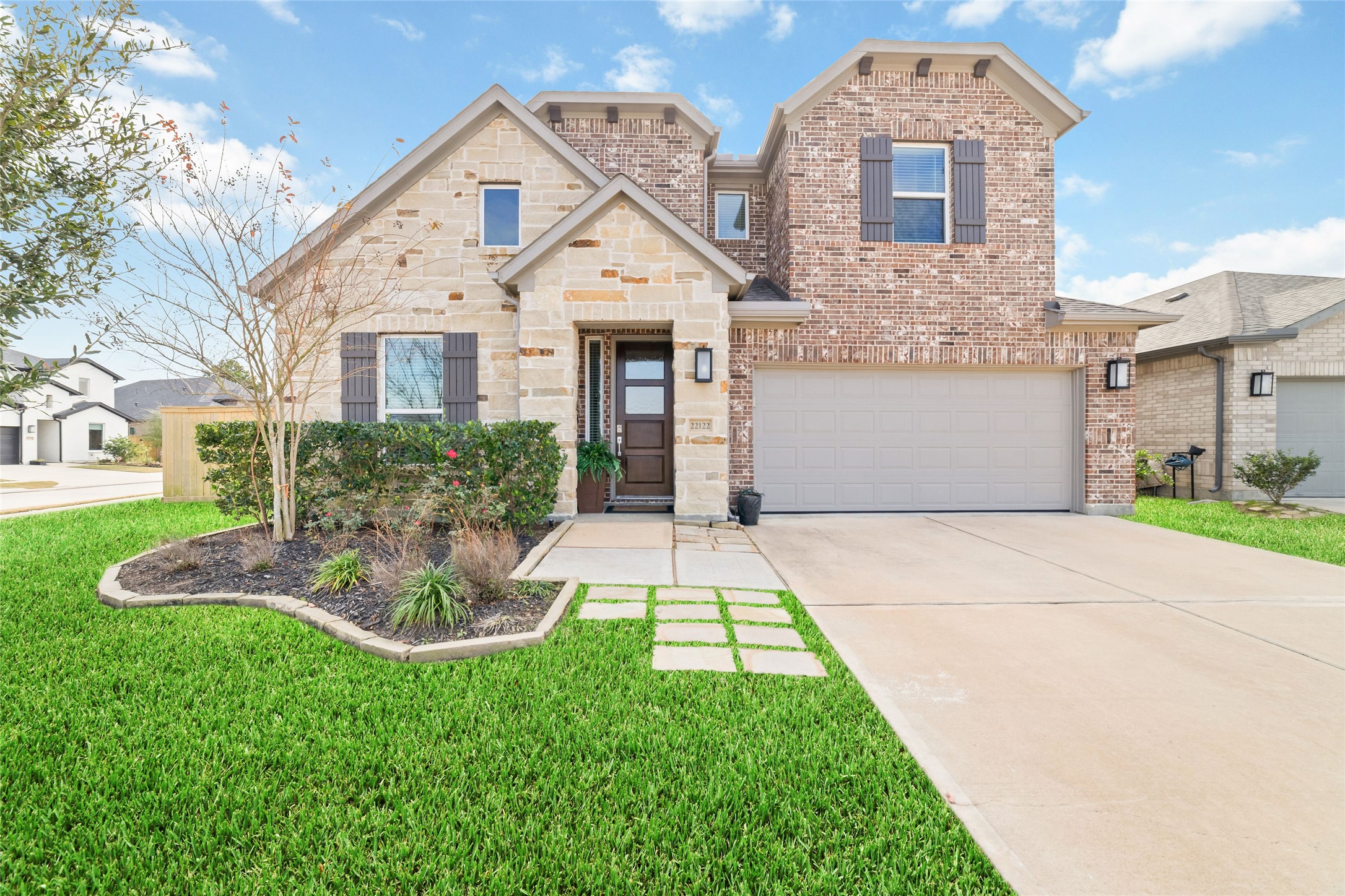 22122 Sam Raburn Drive Tomball, TX 77375 - Photo 2 of 47 a front view of a house with a yard