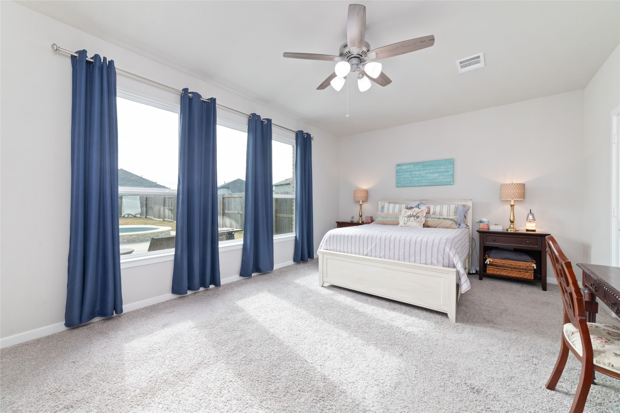 22122 Sam Raburn Drive Tomball, TX 77375 - Photo 24 of 47 Primary Bedroom where you can relax and enjoy a view of the pool.