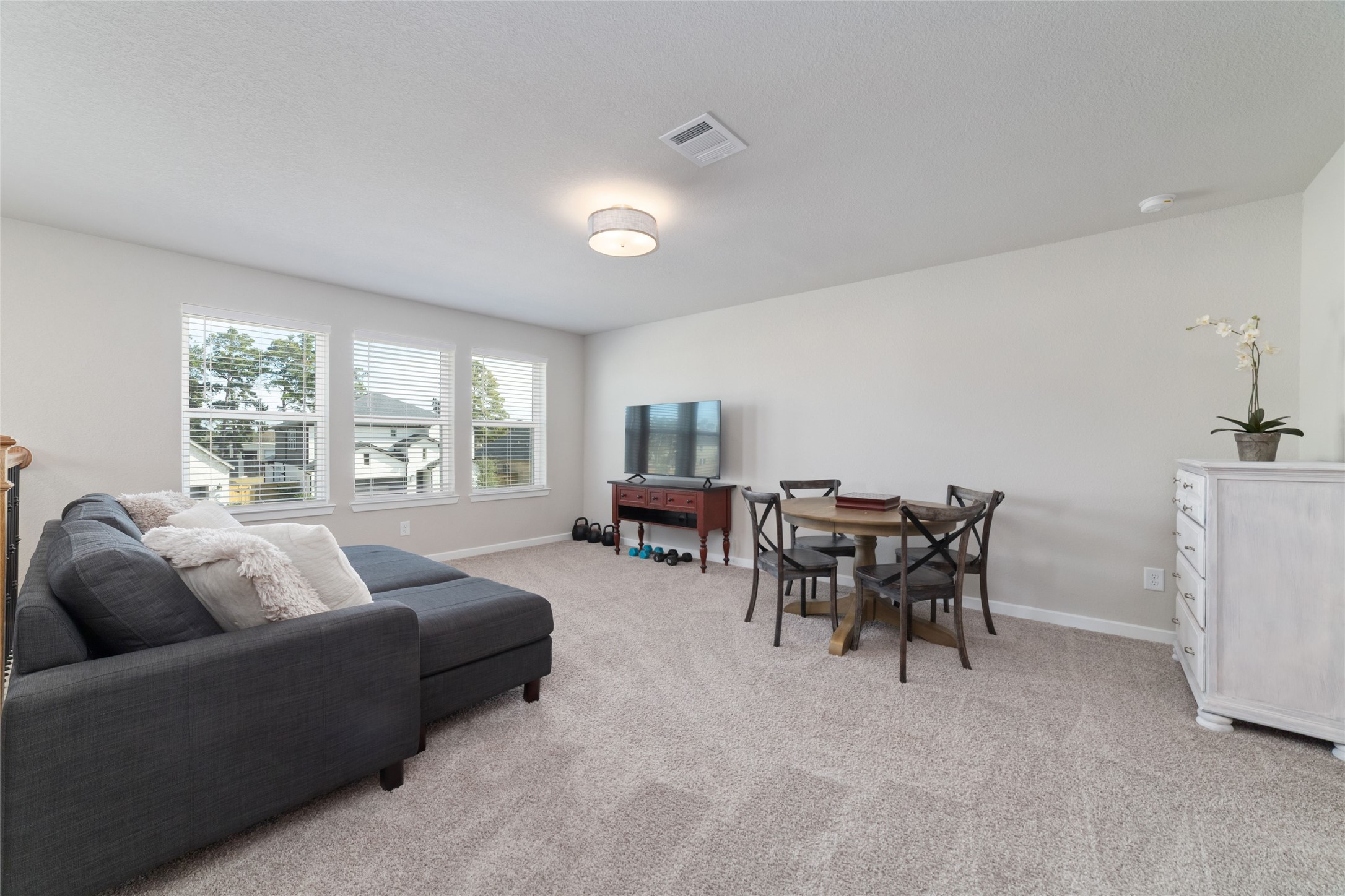 22122 Sam Raburn Drive Tomball, TX 77375 - Photo 32 of 47 a living room with furniture and a table