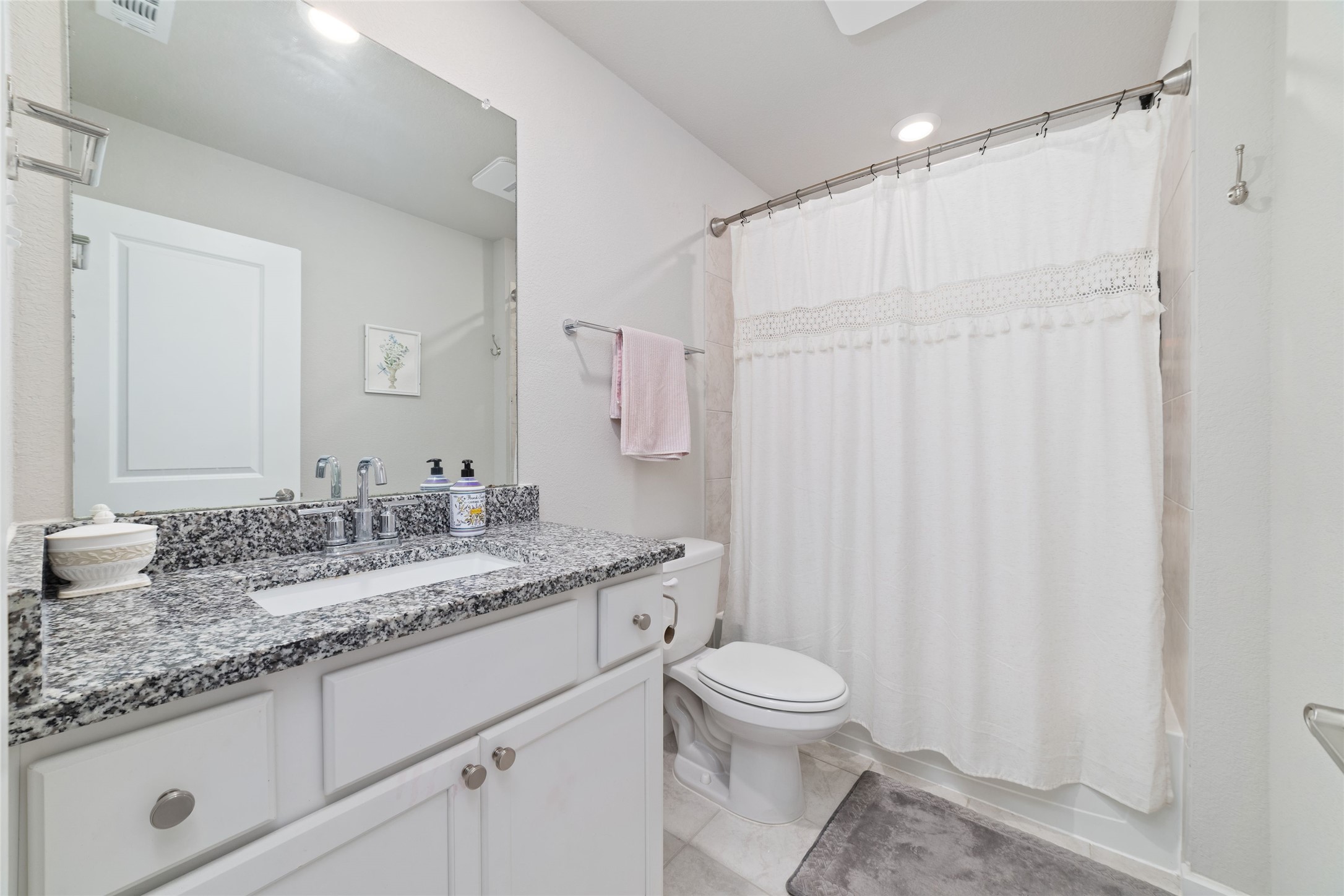 22122 Sam Raburn Drive Tomball, TX 77375 - Photo 38 of 47 The second upstairs bathroom features a tub/shower combo with a large vanity and sink.