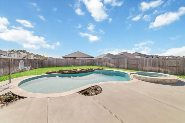 an aerial view of a house with outdoor space