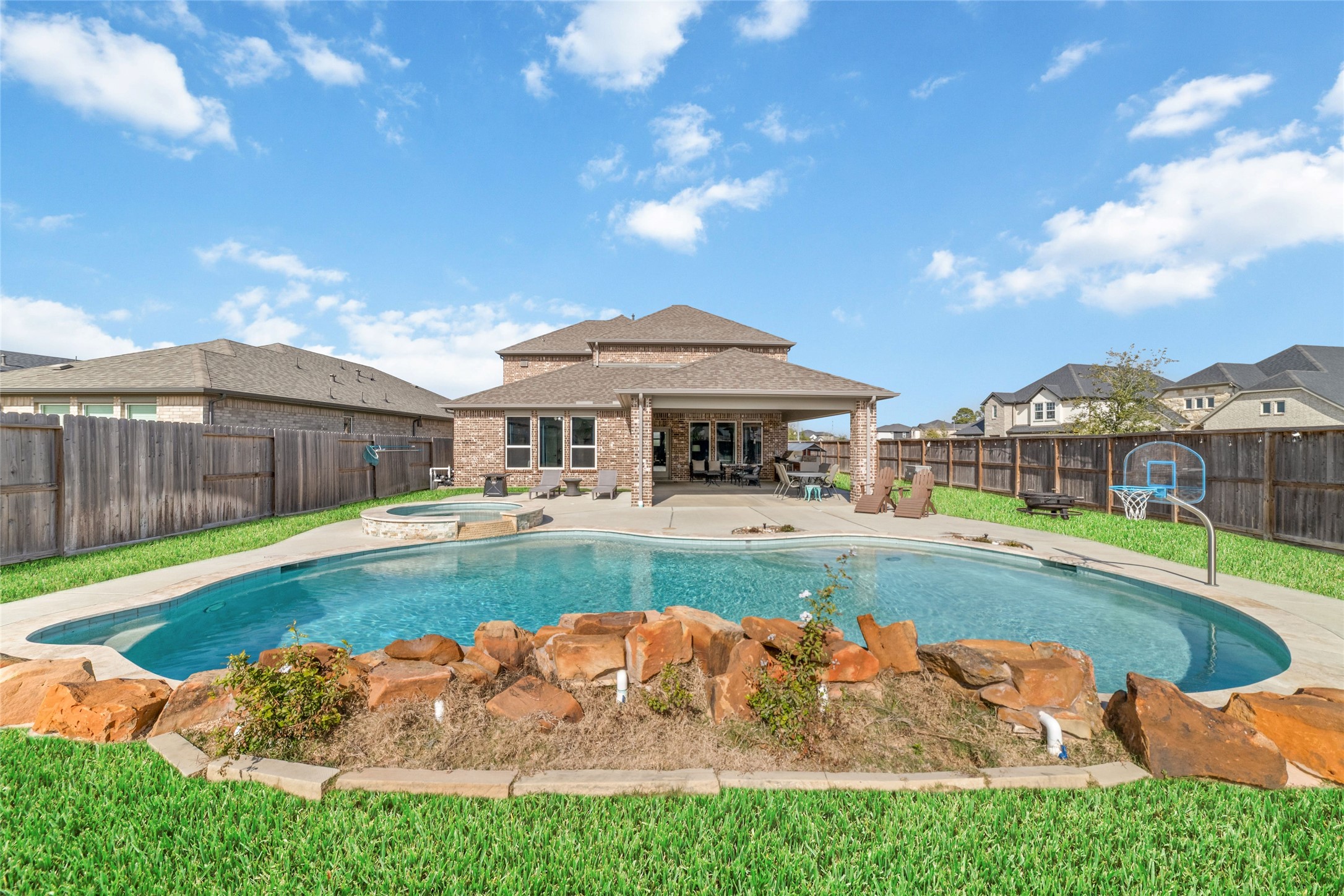 22122 Sam Raburn Drive Tomball, TX 77375 - Photo 40 of 47 a view of a house with swimming pool and a yard