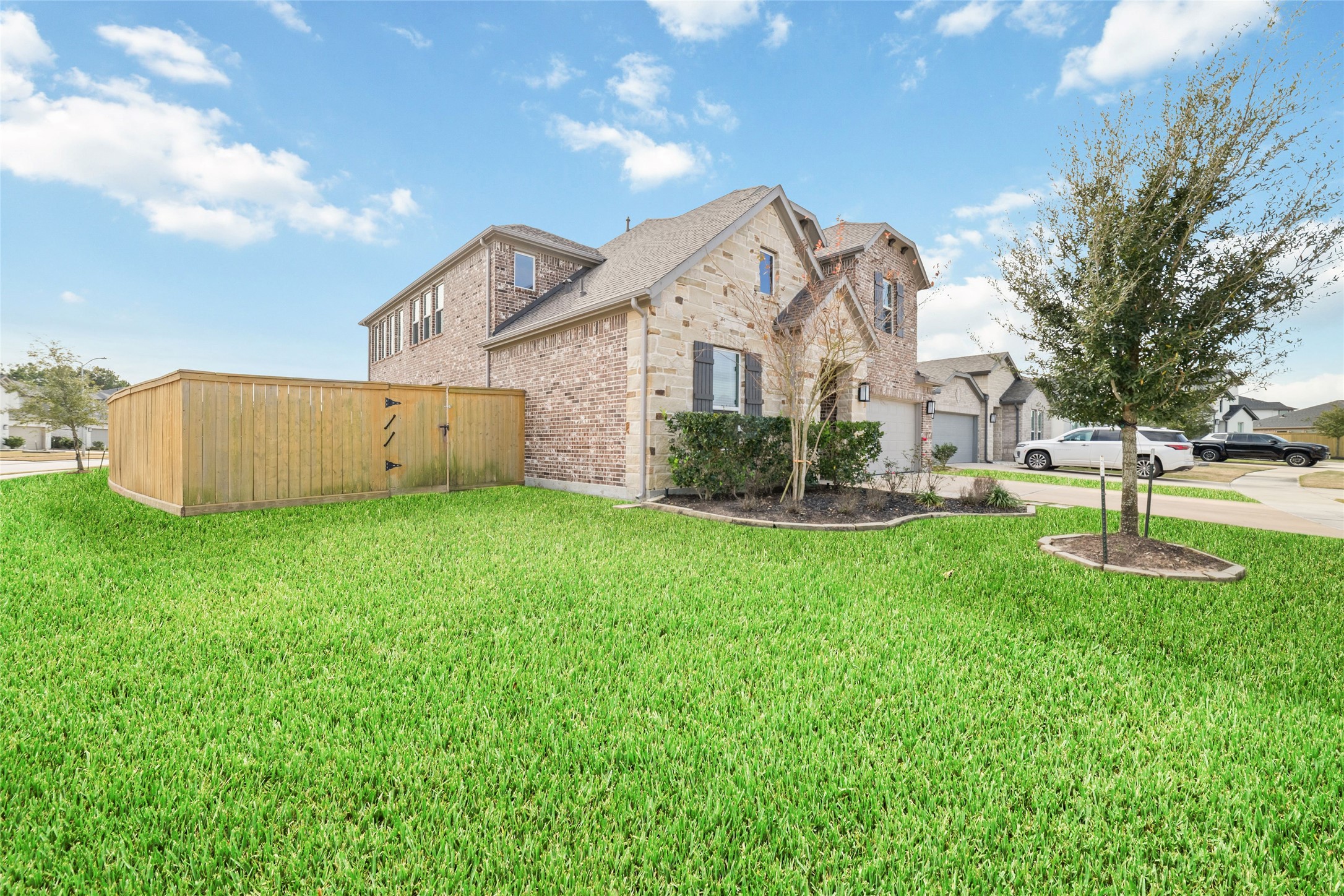 22122 Sam Raburn Drive Tomball, TX 77375 - Photo 4 of 47 Sits on an expansive corner lot just over 12,000 sq ft. With 4-5 bedrooms, a game room, and an open living design, the home provides flexible space perfect for gatherings, relaxation, and growing needs.