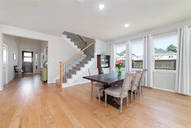 a large kitchen with lots of furniture and appliances