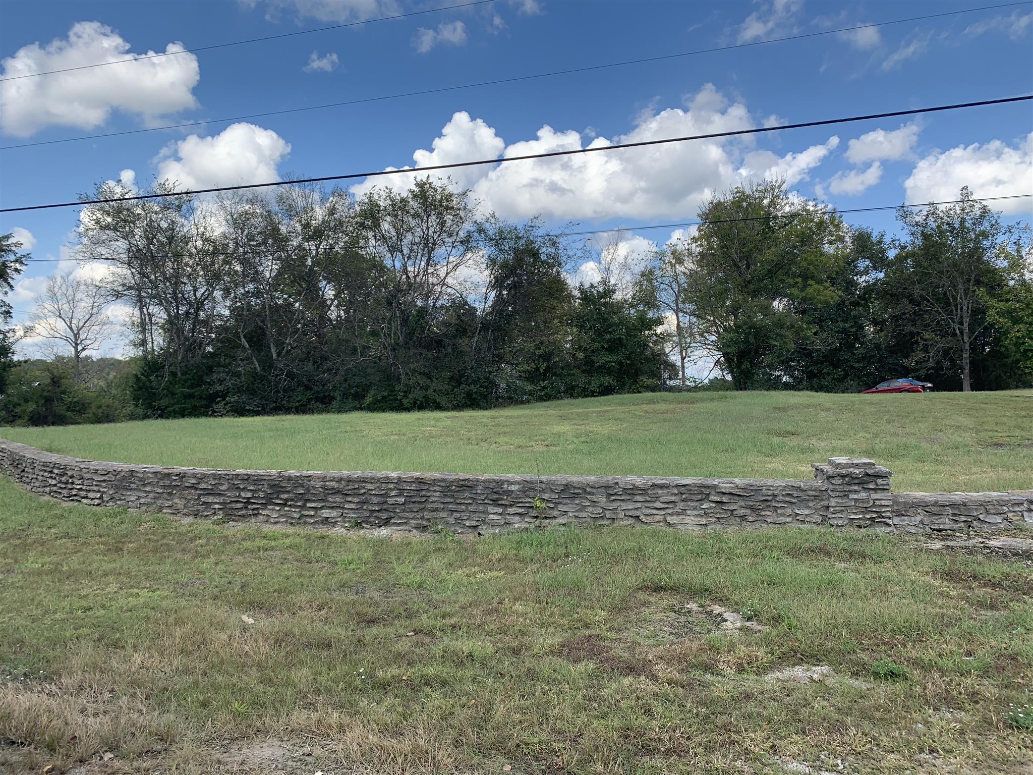 5035 Will Brown Road Spring Hill, TN 37174 - Photo 5 of 8 a view of a golf course with a lake