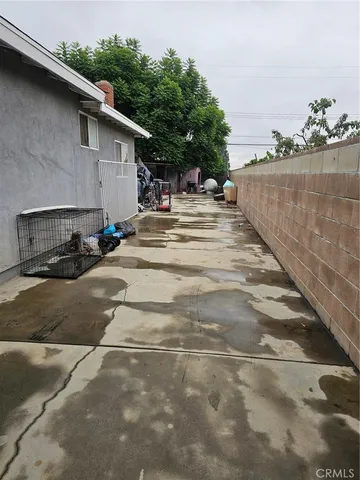 a view of the back of a house with a street