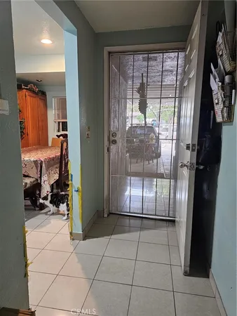 a room with washing machine and cabinets