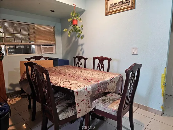 a view of a dining room with furniture and window
