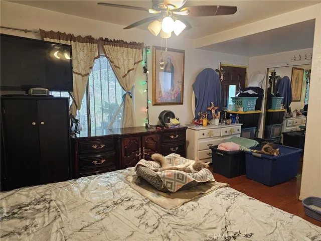 a bedroom with a bed and a mirror