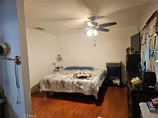 a bedroom with bed and a window