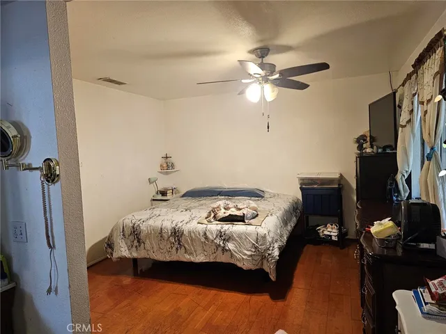 a bedroom with bed and a window