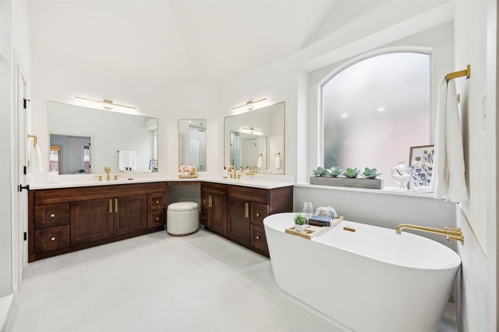 2437 Clear Field Drive Plano, TX 75025 - Photo 19 of 38 a large bathroom with a double vanity sink mirror and a bathtub