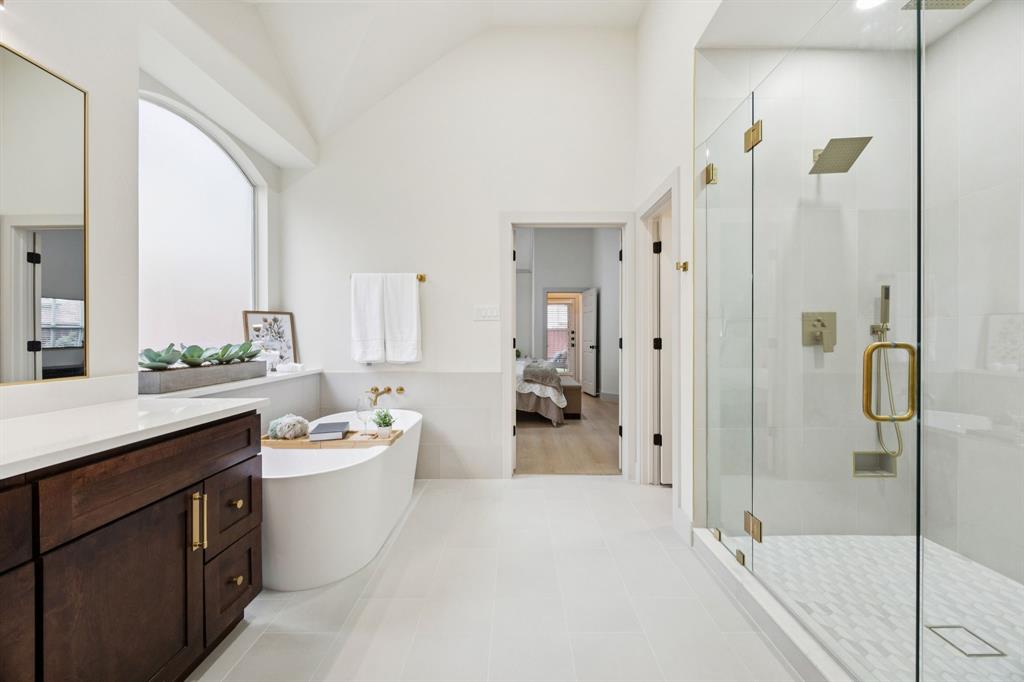 2437 Clear Field Drive Plano, TX 75025 - Photo 20 of 38 a bathroom with a double vanity sink toilet mirror and bathtub