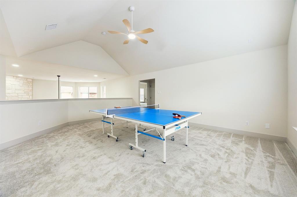 2437 Clear Field Drive Plano, TX 75025 - Photo 23 of 38 an empty room with chandelier fan and windows