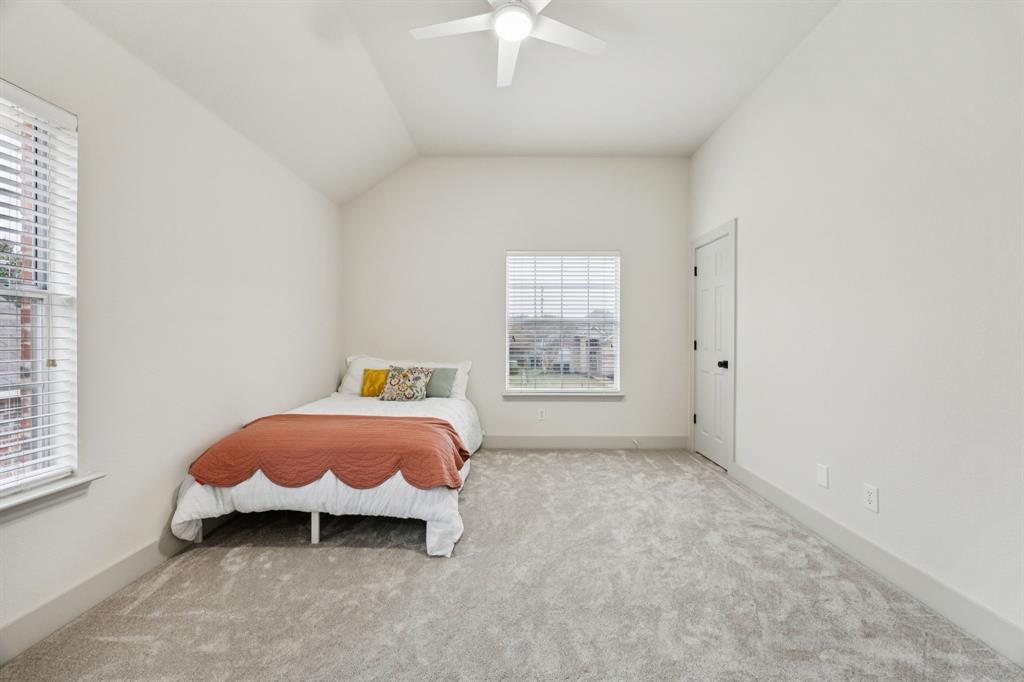 2437 Clear Field Drive Plano, TX 75025 - Photo 25 of 38 a spacious bedroom with a bed and a window