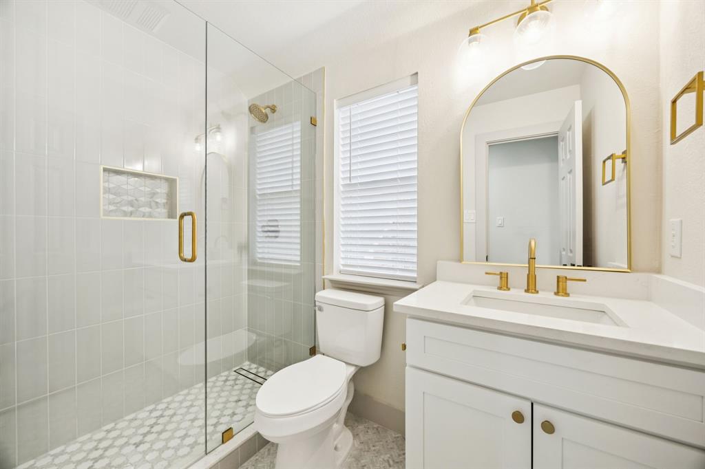 2437 Clear Field Drive Plano, TX 75025 - Photo 26 of 38 a bathroom with a sink toilet and shower