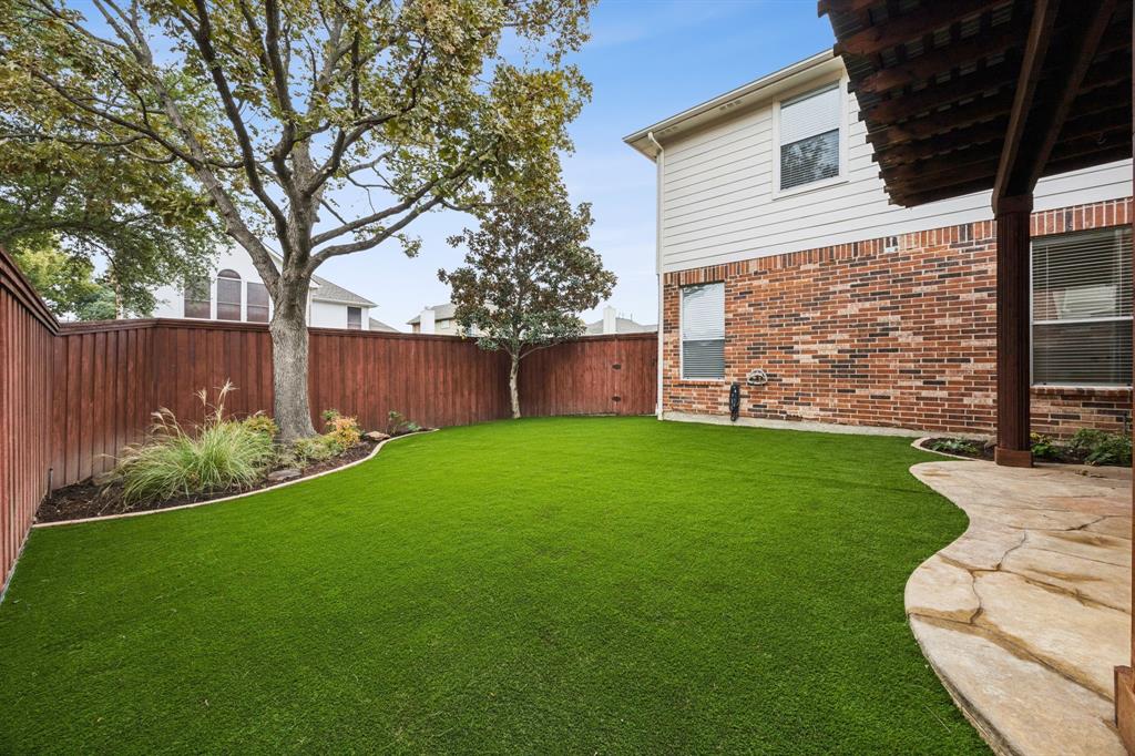 2437 Clear Field Drive Plano, TX 75025 - Photo 33 of 38 front view of a house with a yard