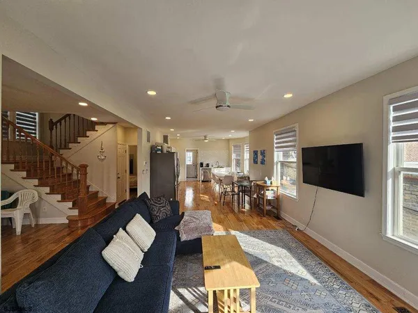 a living room with lots of furniture and a flat screen tv