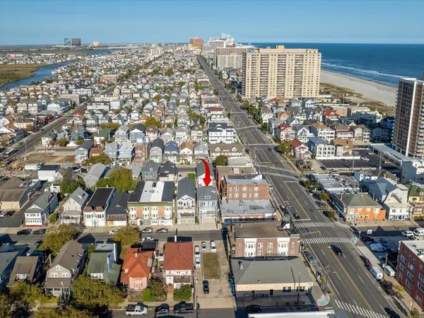 a view of a deck with table and chairs with wooden floor and fence