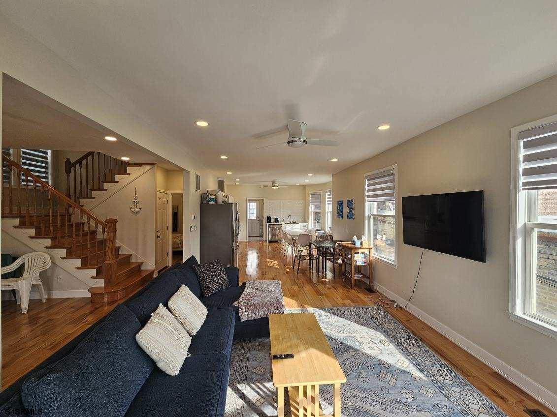 27 South Little Rock Avenue, Unit MAY 2026 Ventnor City, NJ 08406 - Photo 17 of 91 a living room with lots of furniture and a flat screen tv