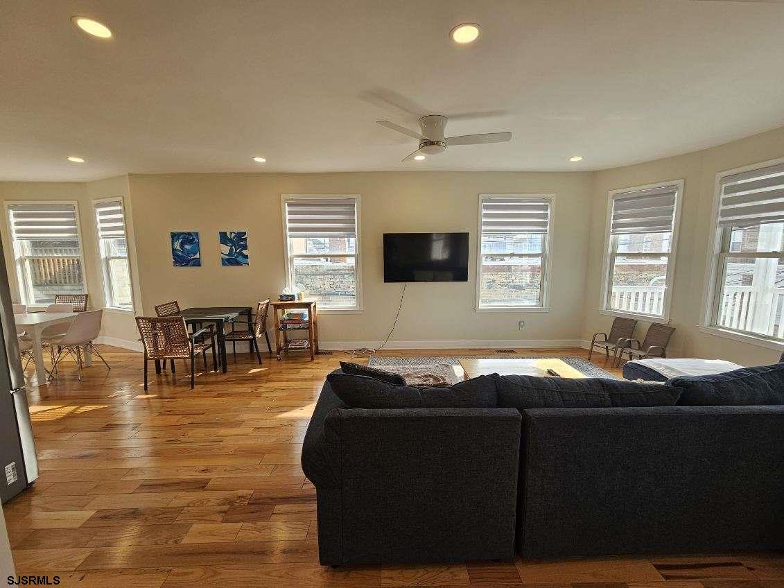 27 South Little Rock Avenue, Unit MAY 2026 Ventnor City, NJ 08406 - Photo 18 of 91 a living room with furniture a dining table and a flat screen tv