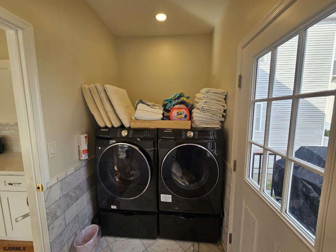 27 South Little Rock Avenue, Unit MAY 2026 Ventnor City, NJ 08406 - Photo 30 of 91 a utility room with dryer and washer
