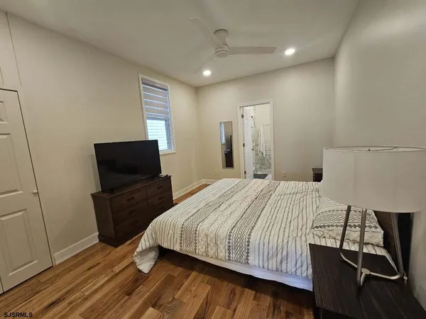 a bedroom with a bed and a chair