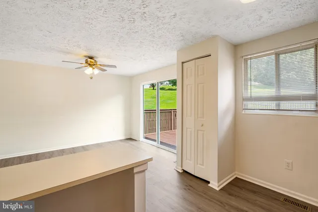 a picture of a bench in front of a wall