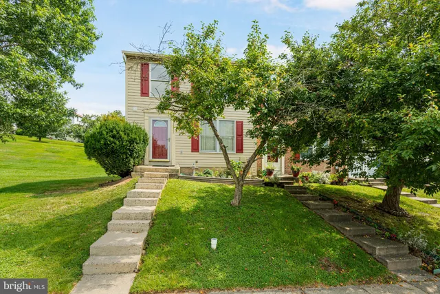 a view of yard with swimming pool and green space