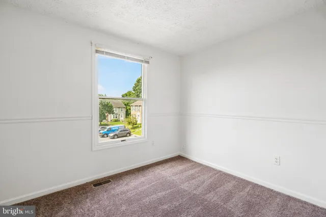 a picture of a park with a bench