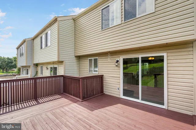 a front view of a house with a yard table and chairs