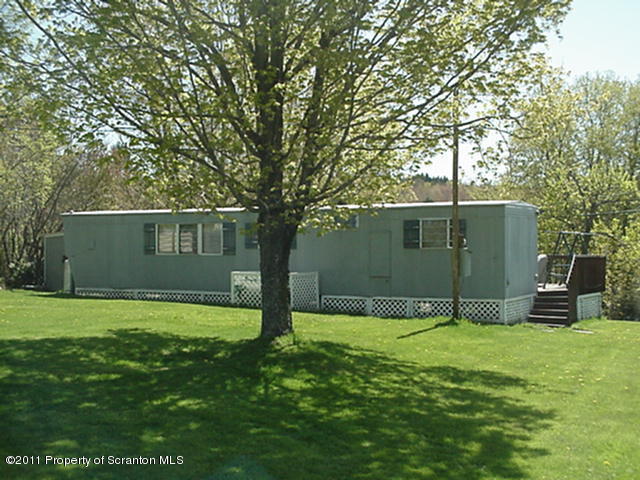 0 Cottrell Road Union Dale, PA 18470 - Photo 3 of 10 a view of a house with a yard