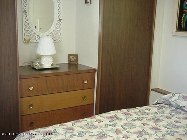 0 Cottrell Road Union Dale, PA 18470 - Photo 6 of 10 a bedroom with a bed and mirror