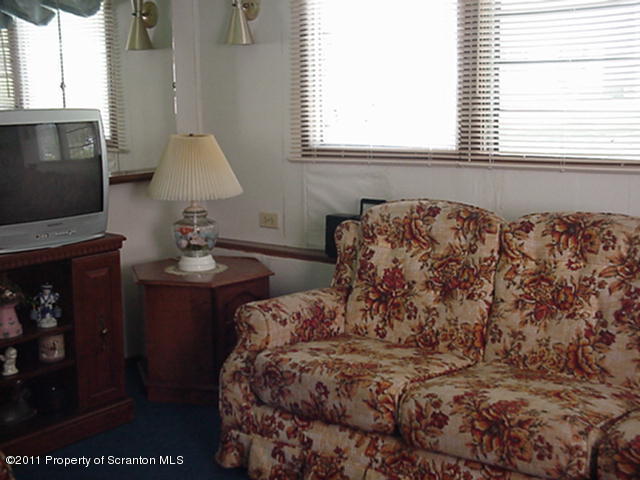 0 Cottrell Road Union Dale, PA 18470 - Photo 7 of 10 a bed sitting in a bedroom next to a window