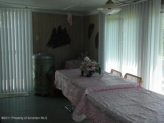 0 Cottrell Road Union Dale, PA 18470 - Photo 8 of 10 a bedroom with a bed and a window